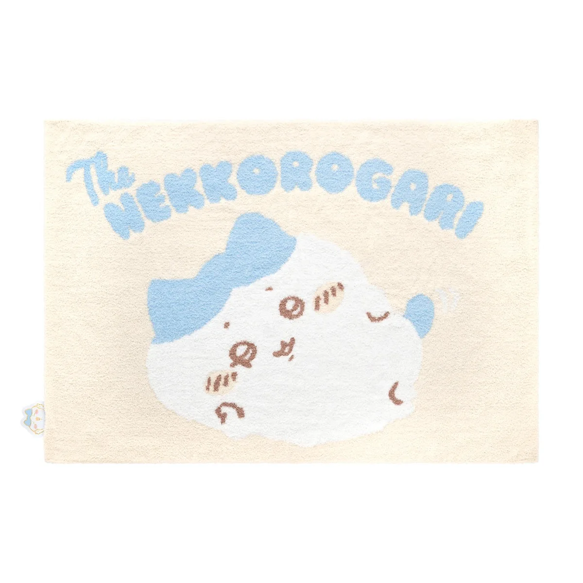 ハチワレのあったかもこもこブランケット。クリーム地にThe NEKKOROGARI